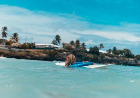 Best Surfing in Barbados: Surfer in the clear water