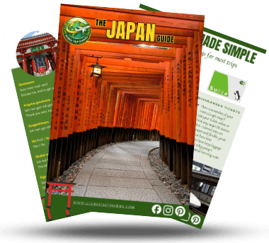 Three pages from the Japan First-Timer Guide fanned out: the orange torii cover, a phrases page, and a transport tips page