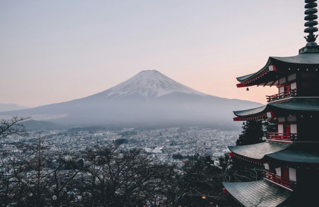 Mount Fuji panoramic view from historic Chureito Pagoda at sunrise, one of Japan's most photographed and iconic travel destinations