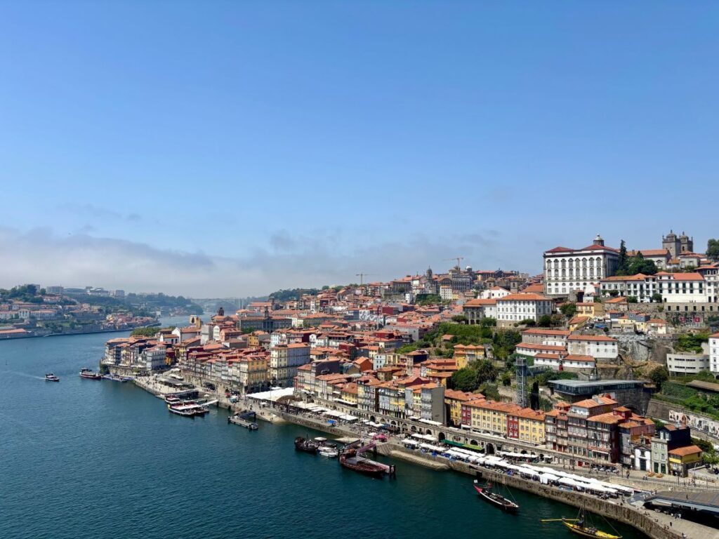 Porto's colourful Ribeira district along Douro River with traditional houses and waterfront restaurants, UNESCO World Heritage site