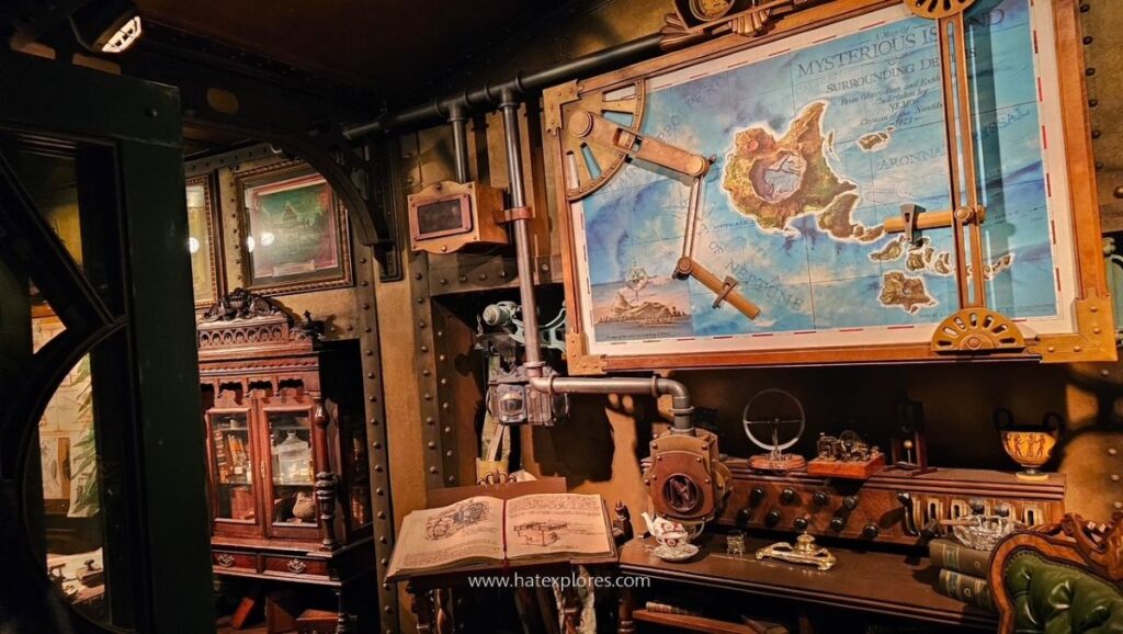Explorer-themed room with maps and instruments, featuring a large Mysterious Island map.