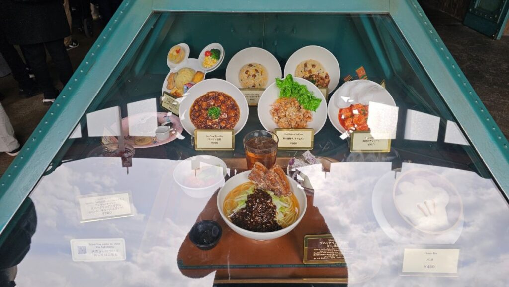 Chinese dishes at Vulcania Restaurant in Tokyo DisneySea, including noodles, rice, and set meals