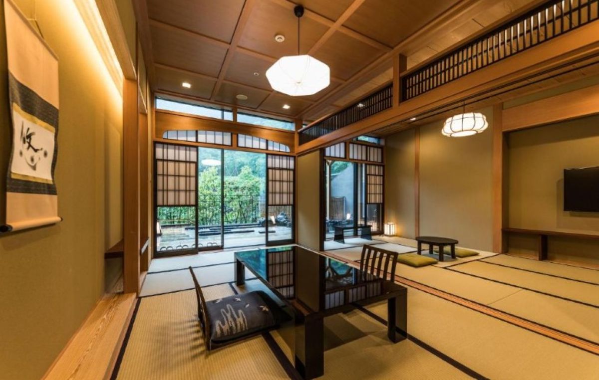 Traditional tatami room with shoji screens and garden views at Hakone ryokan