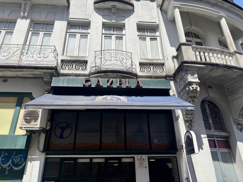 Historic building exterior with ornate balconies and Gazela restaurant signage