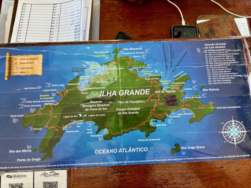 Tourist map showing hiking trails, beaches and villages across Ilha Grande island