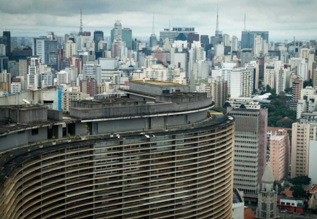 Curved Copan Building in central São Paulo with dense skyline behind it, photographed from above