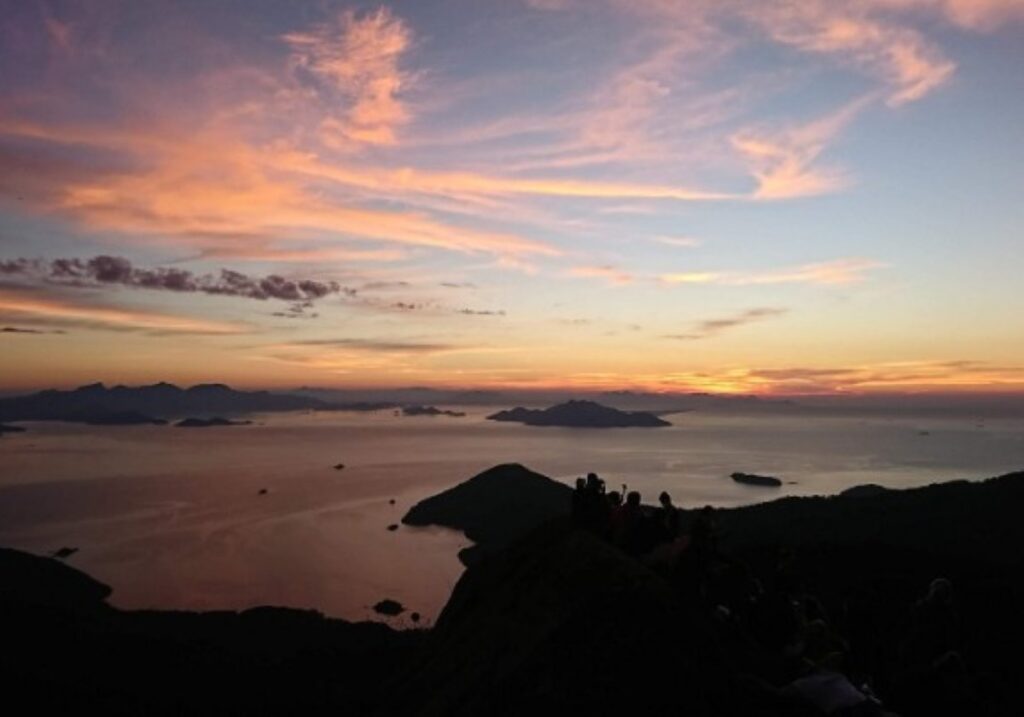 Sunrise view from Pico do Papagaio overlooking islands and ocean in Ilha Grande, Rio de Janeiro