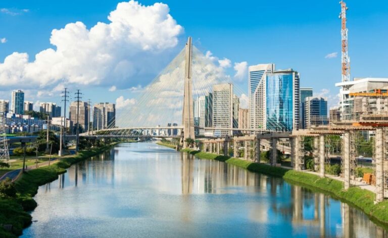 Cable-stayed Ponte Estaiada bridge over the Pinheiros River, with modern towers in the background