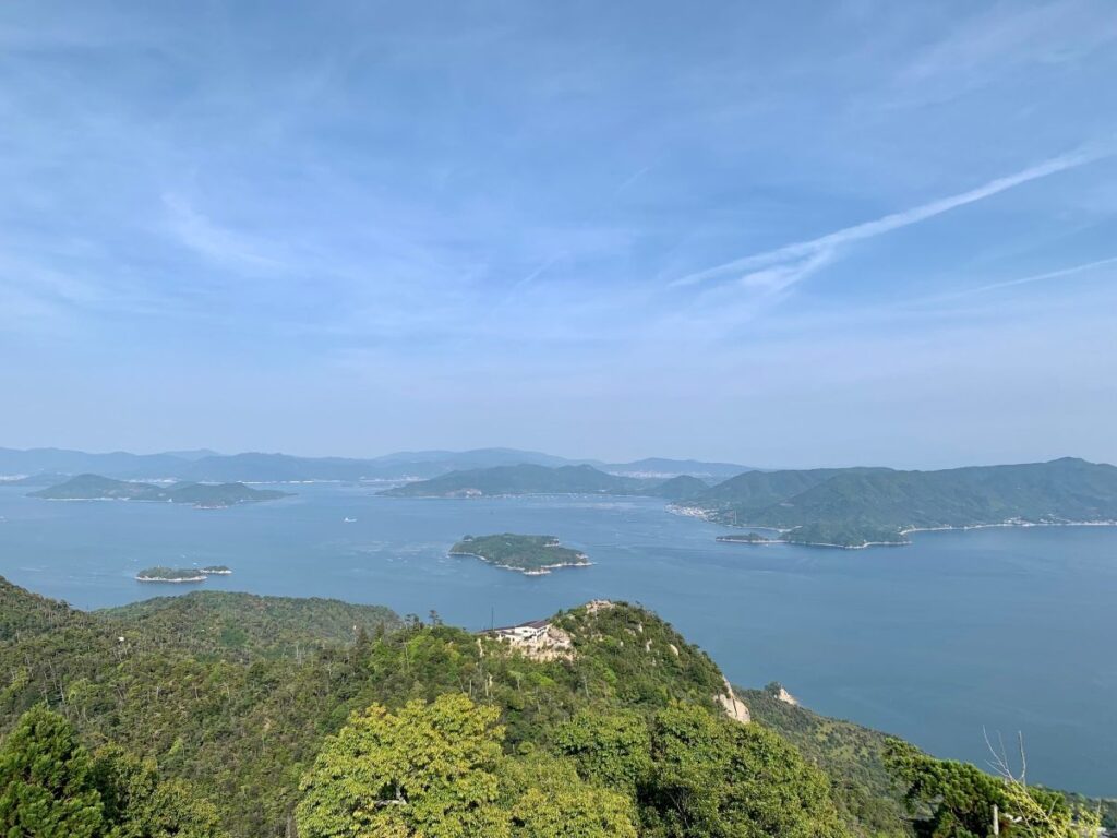 Mount Misen viewpoint over the Seto Inland Sea, scattered islands and peninsulas under a clear blue sky