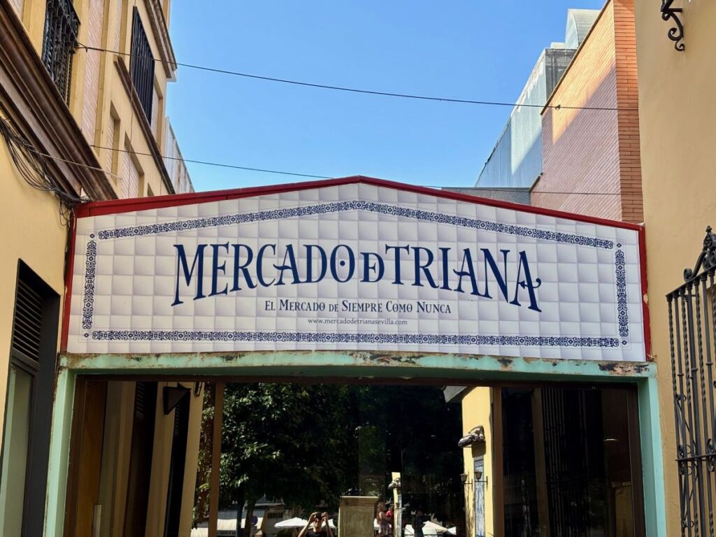 Mercado de Triana entrance sign on a tiled facade in Triana.