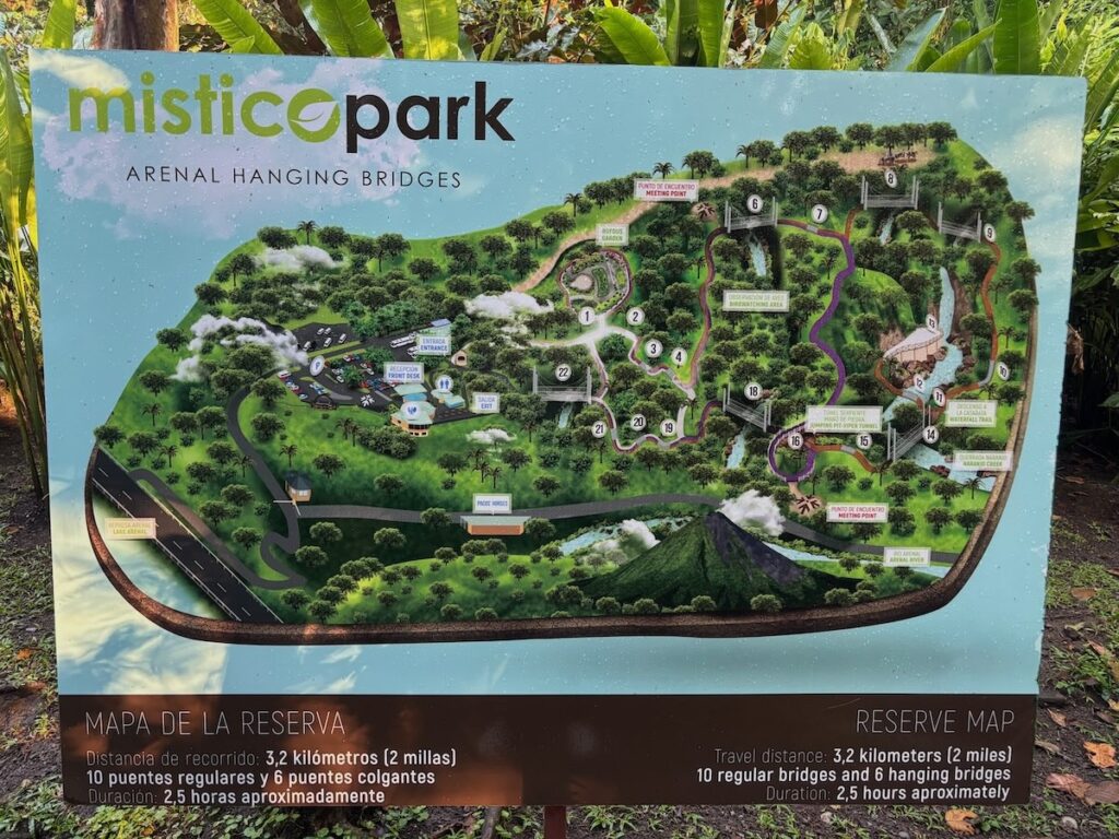 Illustrated Mistico Park Arenal Hanging Bridges reserve map signboard showing the 3.2 km trail loop with regular and hanging bridges.