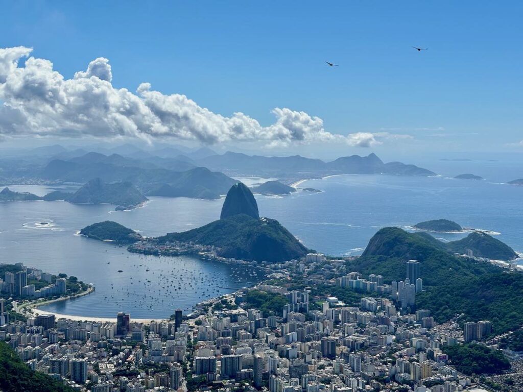 Sugarloaf Mountain and Botafogo Bay viewed from the top of Corcovado, boats anchored in the harbour, Niterói in the distance